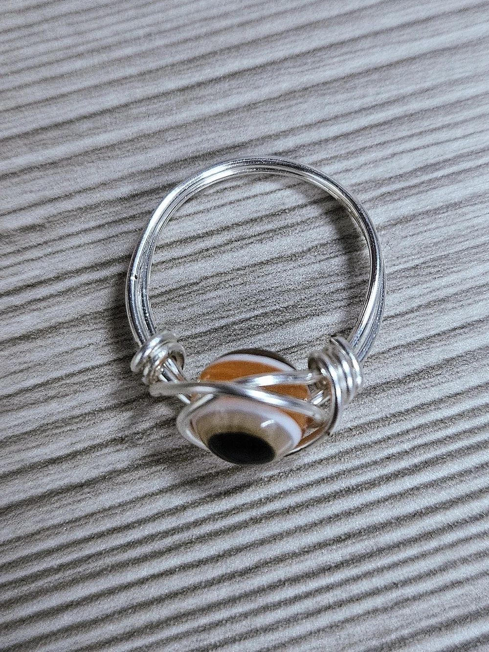 Silver Wire Evil Eye Ring with Orange and Black Glass Accent